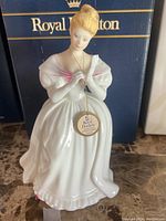 Full view of the Royal Doulton Denise figurine with box in the background