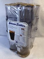 Pack of twelve clear plastic textured tumblers wrapped in shrink plastic with label showing brand, colors, sizes, and features.