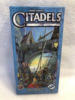 Front view of the new Citadels board game box showing medieval city artwork.