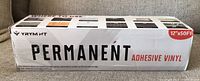 Box showing branding and size of the permanent adhesive vinyl roll, 12in x 50ft.