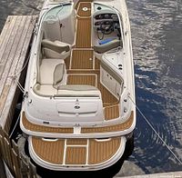 Overhead view of a boat showing teak-style brown EVA foam flooring installed on main deck and swim platform