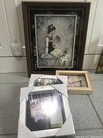 Asian/Chinese styled shadow box featuring seated woman and Dalmatian dog alongside smaller wooden framed artwork.