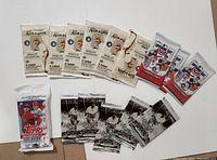 Photo showing all sealed baseball card packs in the lot, including Allen & Ginter, Babe Ruth, Topps 2024 Series 1, and Opening Day sets.