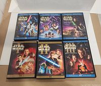 Six Star Wars DVD cases arranged in two rows, showing front covers of the Original Trilogy and Prequel Trilogy special edition movies.