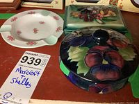 Photo showing all three items: Moorcroft covered boxes (round and rectangular) and Shelley ashtray with floral designs.