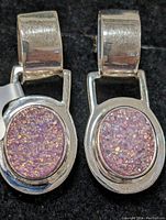 Close-up front view of the sterling silver earrings showing polished metal and druzy stones with iridescent sparkle.