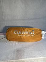 Orange tent carrying bag labeled 'Eureka Summer Wind 2XD' shown front view.
