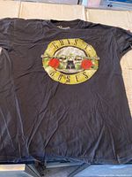 Full view of black Guns N' Roses T-shirt with logo print