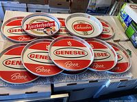 Lots of 9 red and white Genesee Beer trays, 1 Knickerbocker Beer tray with illustration, and 1 Schaefer Beer tray