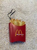 Front view of red French fry carton-shaped McDonald's radio with yellow fries and logo