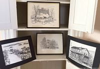 Four black and white sketches displayed together, two framed barn scenes by Les Barnett on top and center and two unframed Tim Hawley sketches on sides.