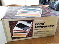 Box of Excalibur Food Dehydrator Model ED 700 showing the product image and features.