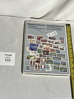 Photo of the sealed souvenir collection of Canada's 1983 postage stamps showing the front cover with various stamp images and the year 1983 prominently displayed.