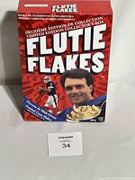 Front and side view of red unopened Flutie Flakes cereal box from 1999 featuring Doug Flutie, Buffalo Bills football player.