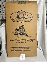 Original brown cardboard box featuring Aladdin 2-Disc Special Edition promotional text and Walt Disney logo, sealed with tape.