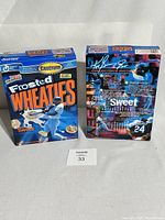 Front and back view of two sealed Ken Griffey Jr. Frosted Wheaties cereal boxes showing artwork and details.