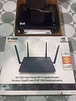 D-Link AC1900 router in original factory packaging with image of router on box and text describing high power Wi-Fi gigabit router.