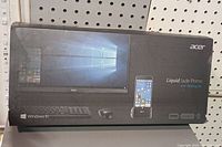 Closed factory packaging of Acer Liquid Jade Primo with Desktop Kit showing product image and Windows 10 logo.