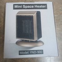 Front of the mini space heater box showing the heater image and model number YND-900.