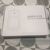 Closed white box with Uhppote Access Control branding and door lock illustration, indicating new factory packaging.