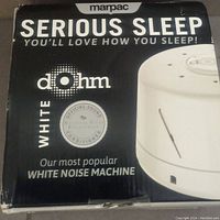 Original box showing Marpac Dohm white noise machine branding and slogan