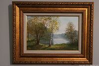 Full view of the framed original oil landscape painting showing detailed frame and artwork.