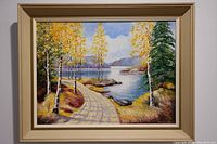 Frontal view of the framed oil painting depicting a lakeside path with birch trees in autumn colors and a calm lake scene with mountains in background.