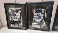 Both framed Toronto Maple Leafs collectibles featuring Frank Mahovlich and Johnny Bower displayed side-by-side showing full front images.