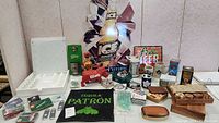 Wide view showing multiple bar signs, collectibles, and game components arranged on a tabletop.