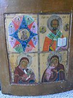 Full view of the four-section religious icon painted on a wooden panel showing Virgin Mary with Child Jesus, Saint Nicholas, and surrounding angels with gold accents.