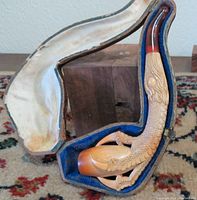 Meerschaum fish pipe inside fitted felt-lined case