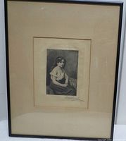 Framed portrait print showing a full view of the artwork and its black frame with beige matting.