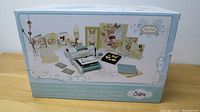 Front view of sealed retail box showing Sizzix Big Shot machine and sample projects