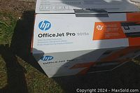 Top view of the sealed HP OfficeJet Pro 9015e printer box showing branding and model number.