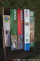 Five 1000-piece jigsaw puzzles in original boxes, each with distinct packaging and artwork.