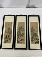 Three complementary vintage Chinese silk paintings depicting mountain landscapes, each in a black thin frame with white mat, arranged side by side showing full length and proportion.