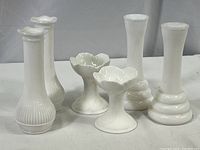 All five items in the lot placed on a flat surface with a neutral background showing their relative sizes and shapes.