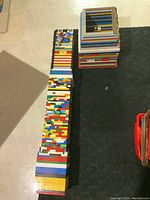 Top-view of the LEGO tower showing the hollow center and multiple colored layers formed into a square tower shape.