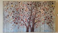Front view of print on board wall art featuring a tree with colorful leaves.