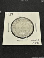 Front side of the 1919 Newfoundland 50 cents silver coin, showing denomination and date.