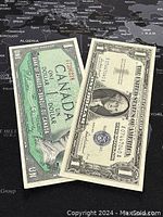Photo showing both the 1954 Canadian one dollar banknote and the 1957 US one dollar banknote side by side on a world map background.