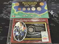 Set of five Normandy D-Day invasion commemorative coins displayed on a blue background map, labeled 'Normandy D-Day Invasion 1944-1994' from Canada Remembers.