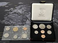 1978 Royal Canadian Mint coin set displayed in black presentation box with white lid interior showing the mint's logo. The set has multiple coins arranged with reflective metal surfaces, including denominations from penny to dollar coins.