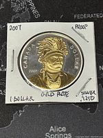 Obverse side of the 2007 Canadian silver dollar coin showing gold-plated portrait of Thayendanegea (Joseph Brant) with inscriptions and year 2007, in proof condition.