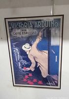 Full view of framed vintage advertisement print showing a man serving espresso cups, with artist signature visible