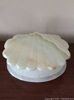 Closed clam design marble onyx trinket jewelry box with smooth polished finish and natural coloration.
