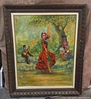Full front view of the framed painting showing the flamenco dancer, guitarist, and seated figures in an outdoor setting with trees and foliage.