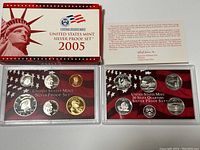 Photo showing the full set packaging with coins inside protective holders and the information card.