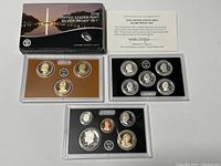 Full display of the 2016 US Mint Silver Proof Set including three separate plastic holders with coins, certificate of authenticity, and collectible box.