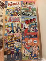 Six Archie Comics laid out together showing the front covers including Veronica, Betty and Veronica, Archie & Friends, Weird Mysteries and Jughead Comics